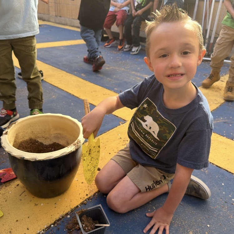 Students in Kindergarten through 2nd grade ASC, learning about planting flowers and growing a garden. 