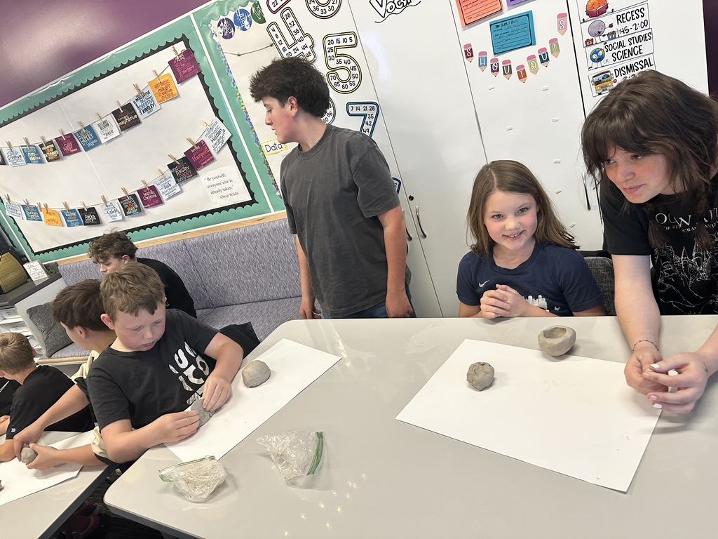 students sculpting things out of clay