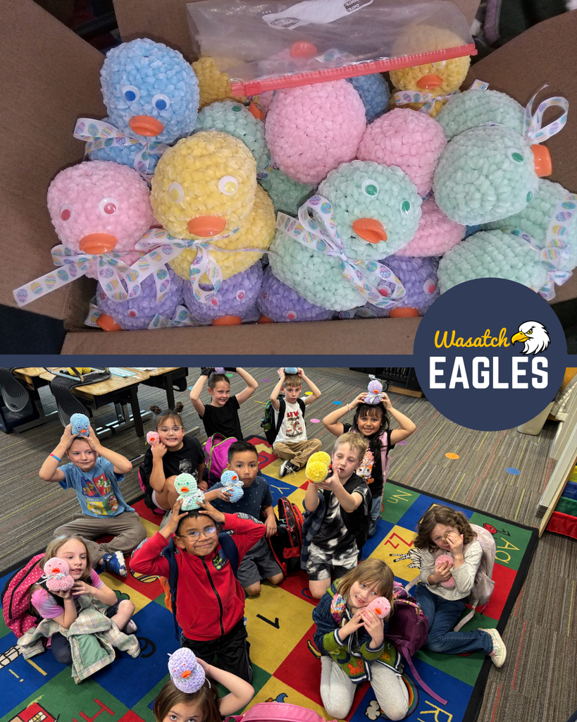 A two‑image collage. The top image shows a cardboard box filled with handmade crocheted ducks in pastel colors, each with an orange beak and a patterned ribbon tied around its neck. The bottom image shows a group of 1st grade students sitting and kneeling on a colorful classroom rug, each holding or wearing one of the handmade ducks. A “Wasatch Eagles” logo appears in the lower right corner of the collage.