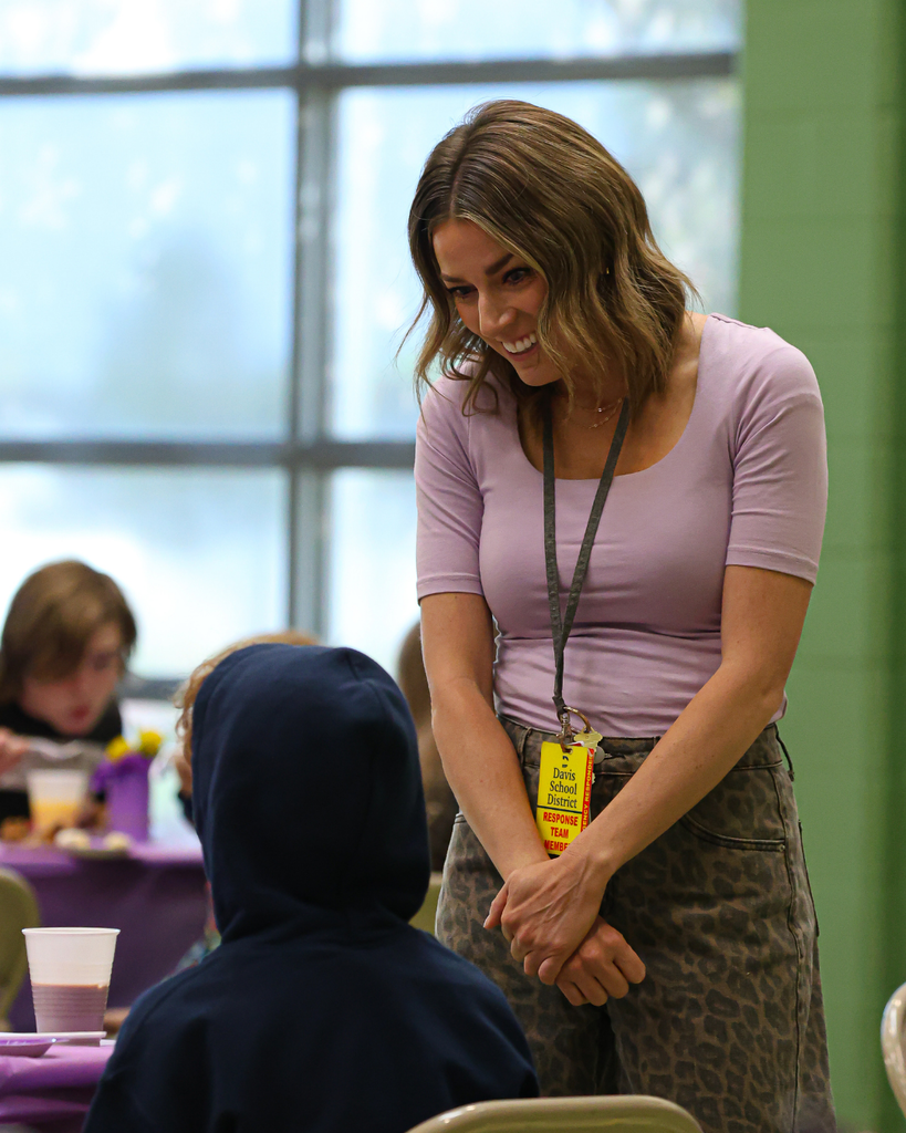 A military family advocate speaks with a student.