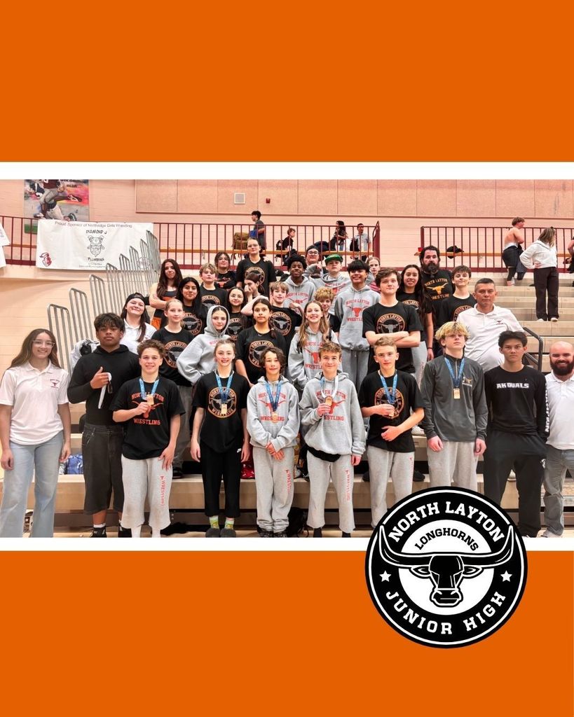 North Layton Jr. High Wrestlers standing in a group photo after a competition.