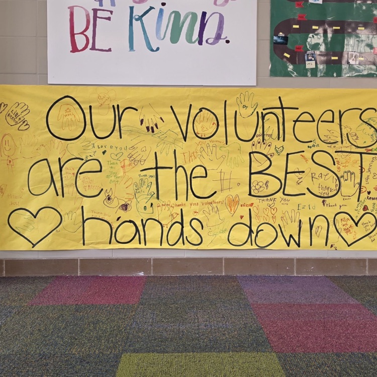 student signed poster for volunteers