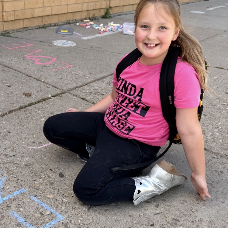 3rd graders enjoying chalk day for an end of year ABC countdown activity 