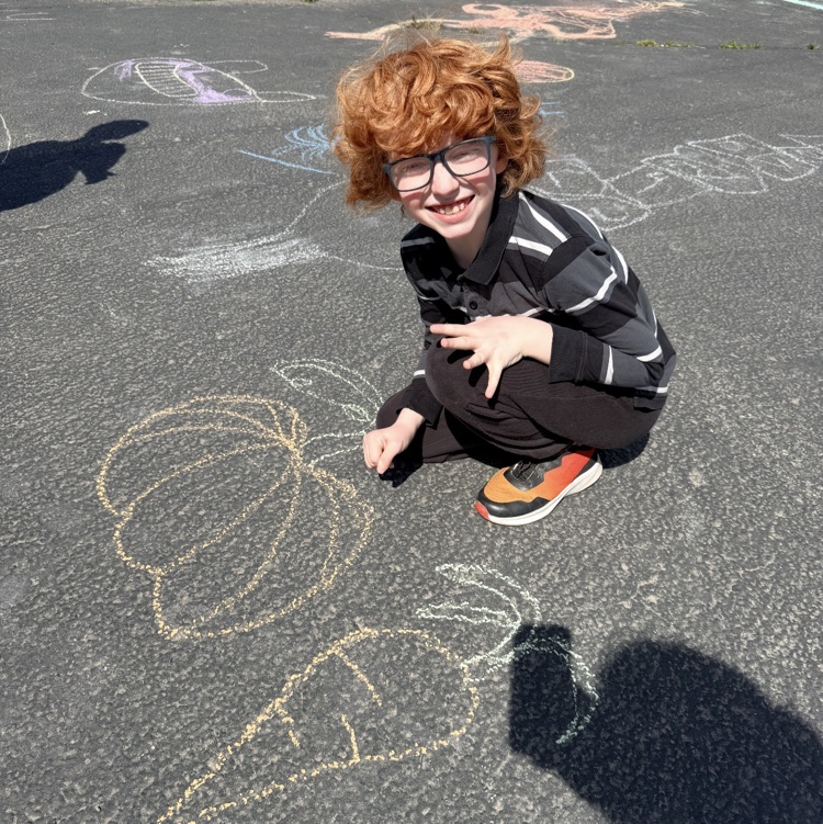 3rd graders enjoying chalk day for an end of year ABC countdown activity 