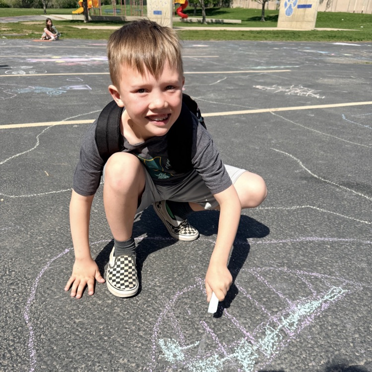 3rd graders enjoying chalk day for an end of year ABC countdown activity 