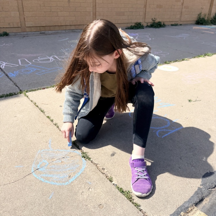 3rd graders enjoying chalk day for an end of year ABC countdown activity 