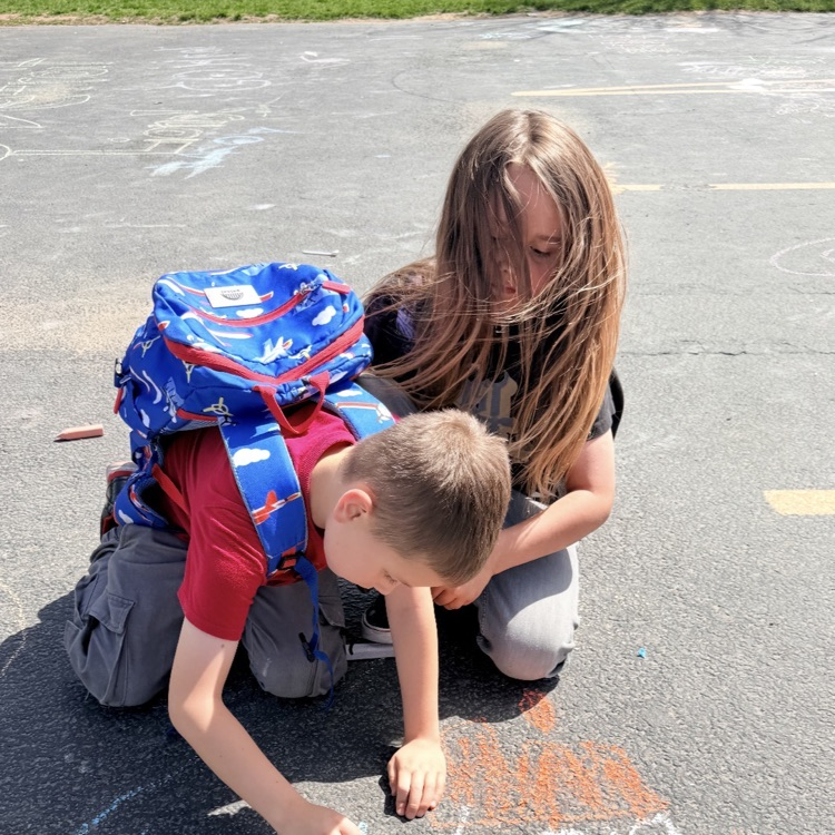 3rd graders enjoying chalk day for an end of year ABC countdown activity 