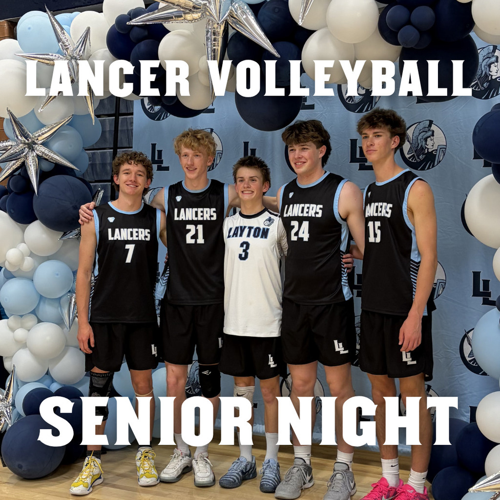 picture of five Lancer volleyball seniors standing under a Lancer themed balloon arch and backdrop