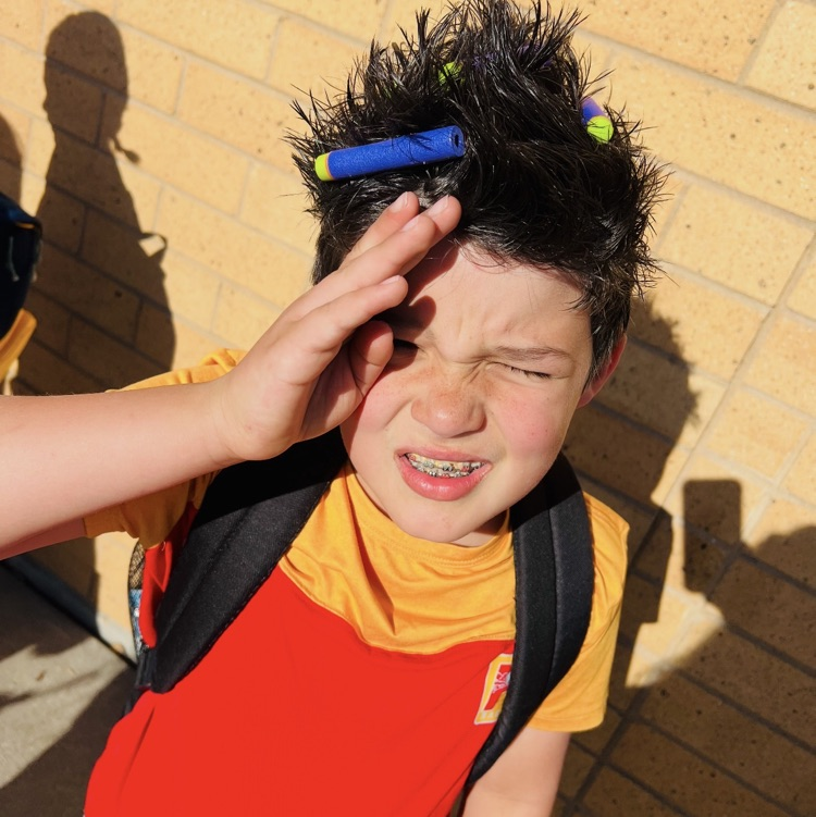 2nd graders showing their crazy hair styles for an ABC countdown end of year activity 