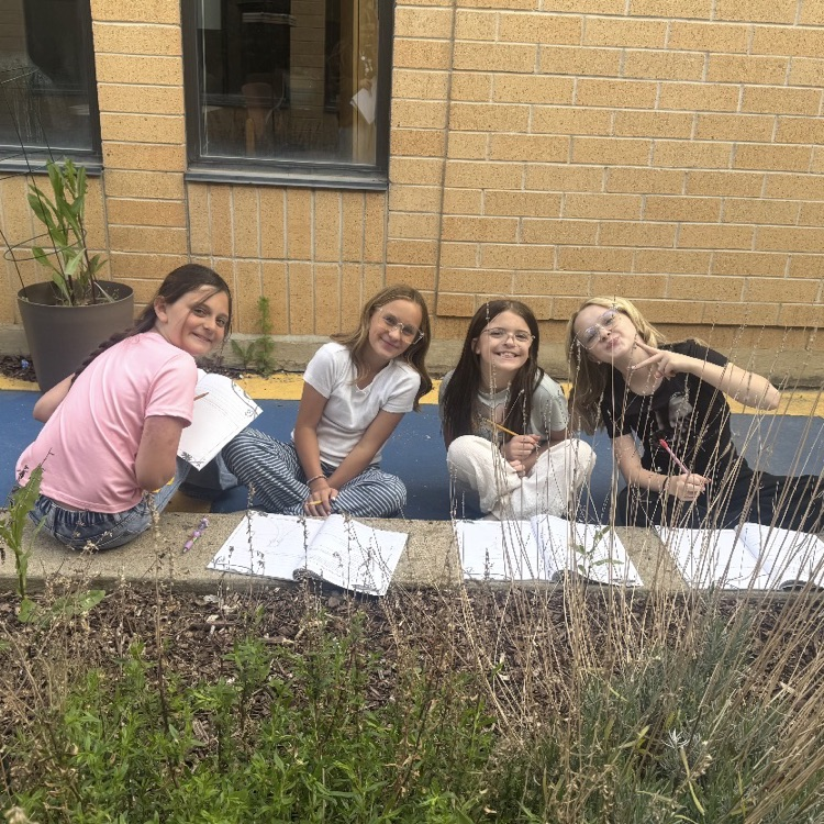 students working on their assignment outside 