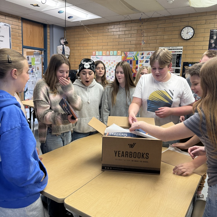 Yearbook staff seeing the new yearbook reveal