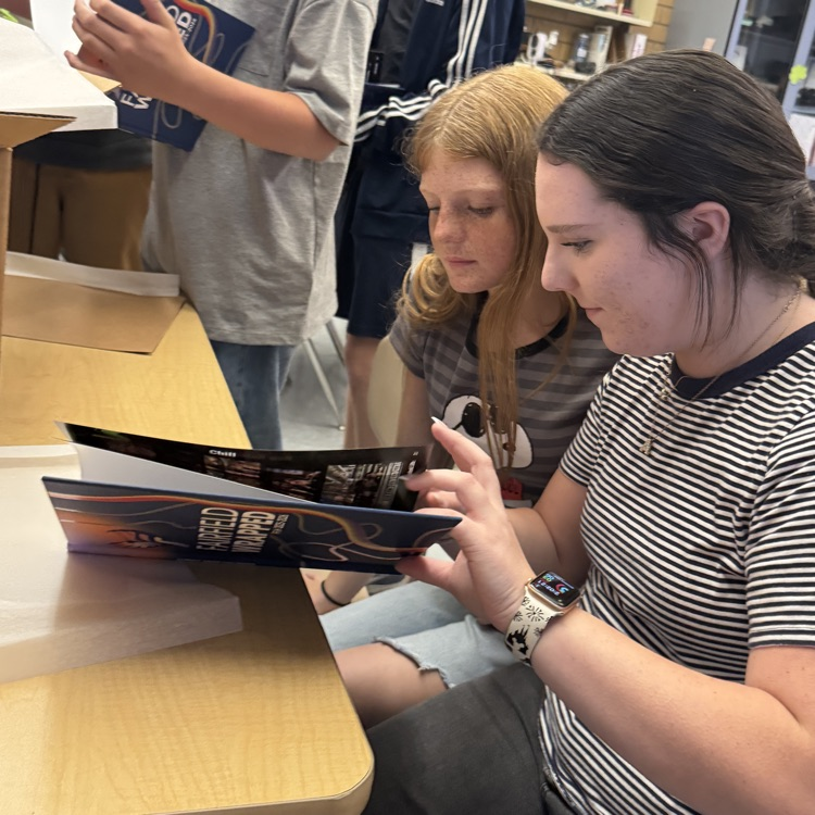 Yearbook staff seeing the new yearbook reveal