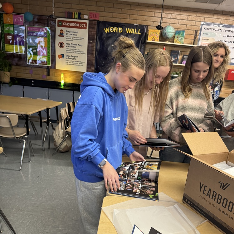 Yearbook staff seeing the new yearbook reveal
