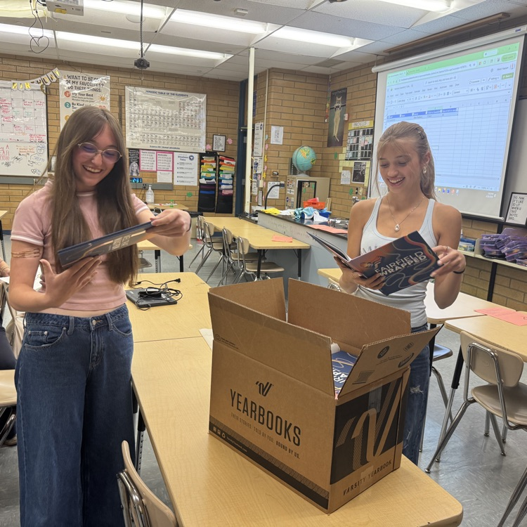 Yearbook staff seeing the new yearbook reveal