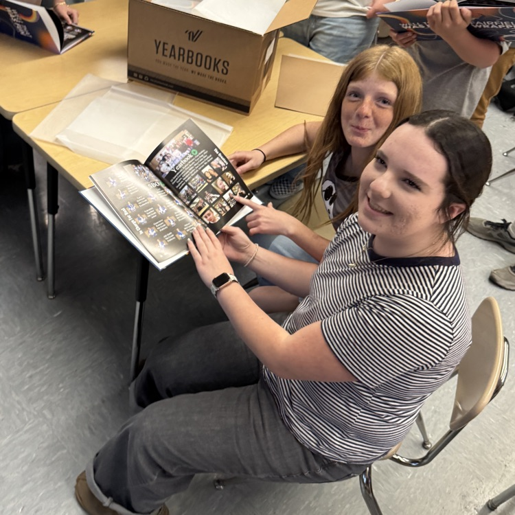 Yearbook staff seeing the new yearbook reveal