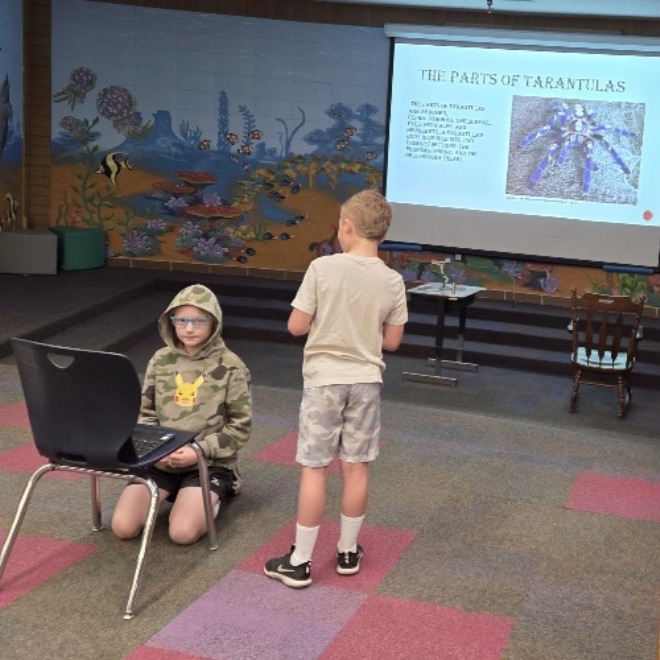 4th graders giving reports during library time 