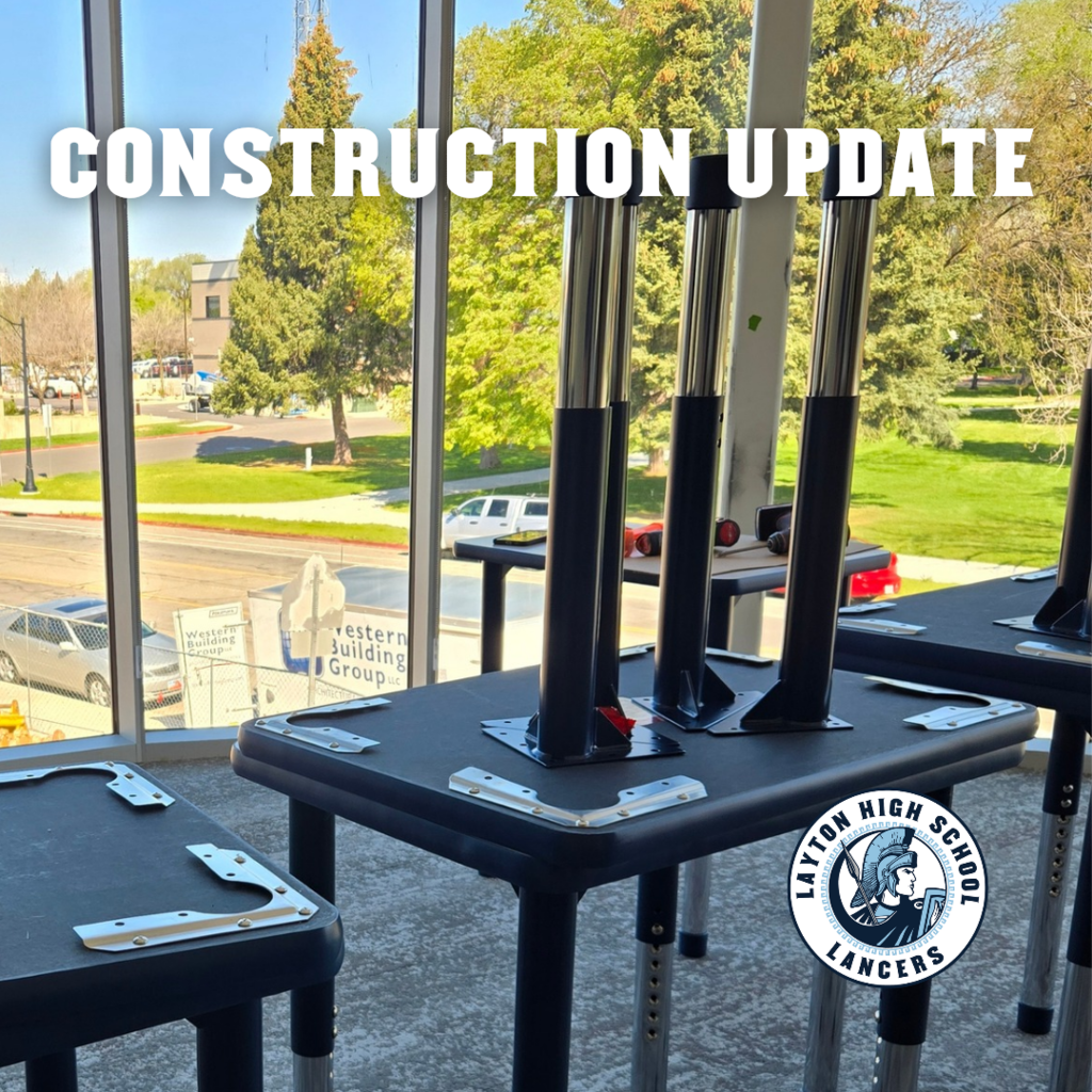 picture of partially assembled tables in a new classroom