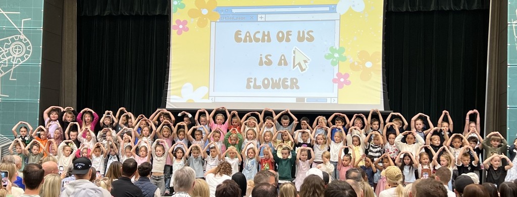 first grade students performing on the stage
