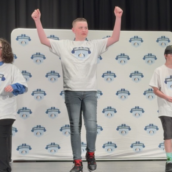 Corbin dances with the group