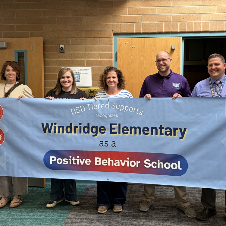 Principal Reid, Mrs. Hyde, Mrs. Hauck are all shown with district representatives recovering a banner recognizing our school’s efforts!