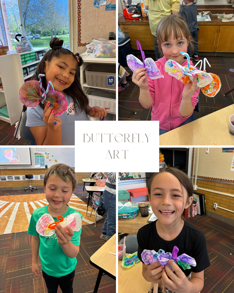 1st grade students in Sims class showing the coffee filter art they made. 