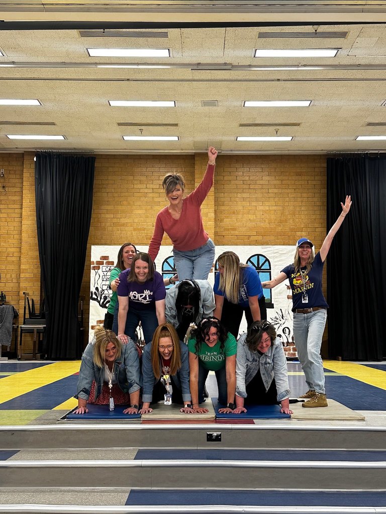 Human pyramid of teachers and principal