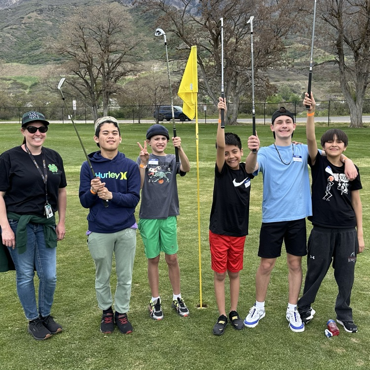 Students playing golf