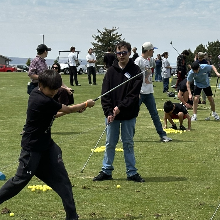 Students playing golf