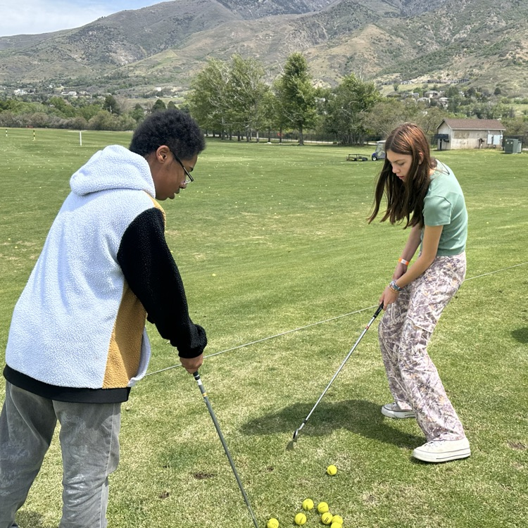 Students playing golf 