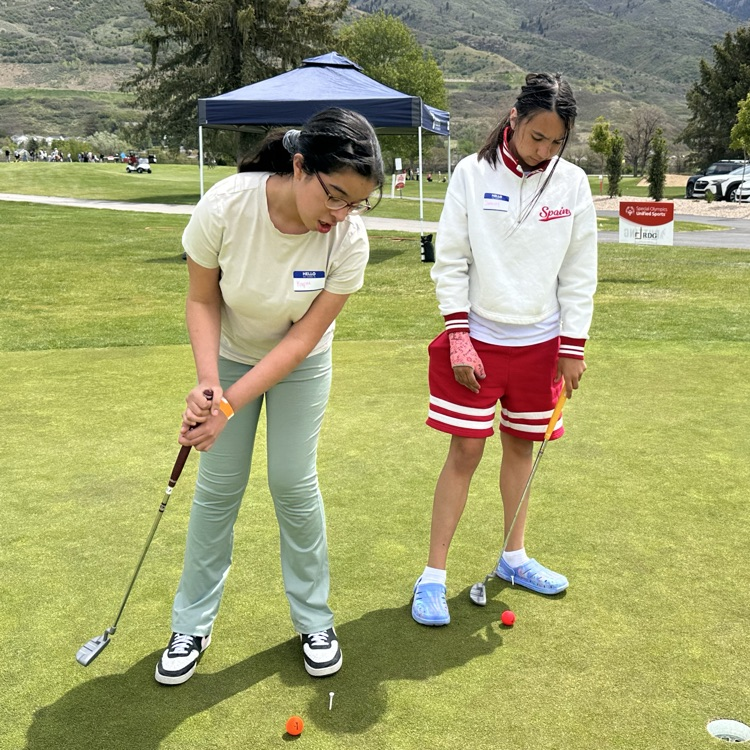 Students playing golf 