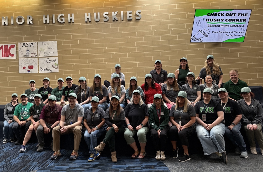 FJH faculty all wearing hats and Spirit Gear. 