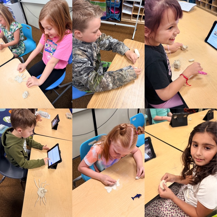 2nd graders working on clay animals for their animal reports 