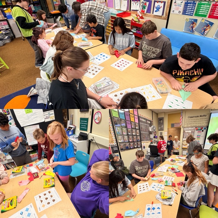 2nd graders working on origami creations with 6th graders