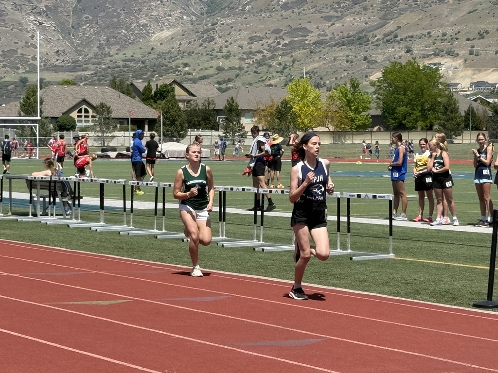 FJH track student running. 