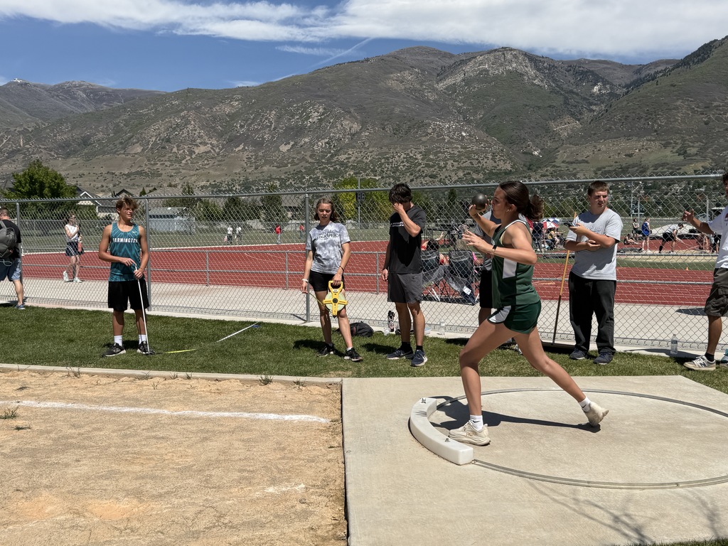 FJH student competing in shotput event. 