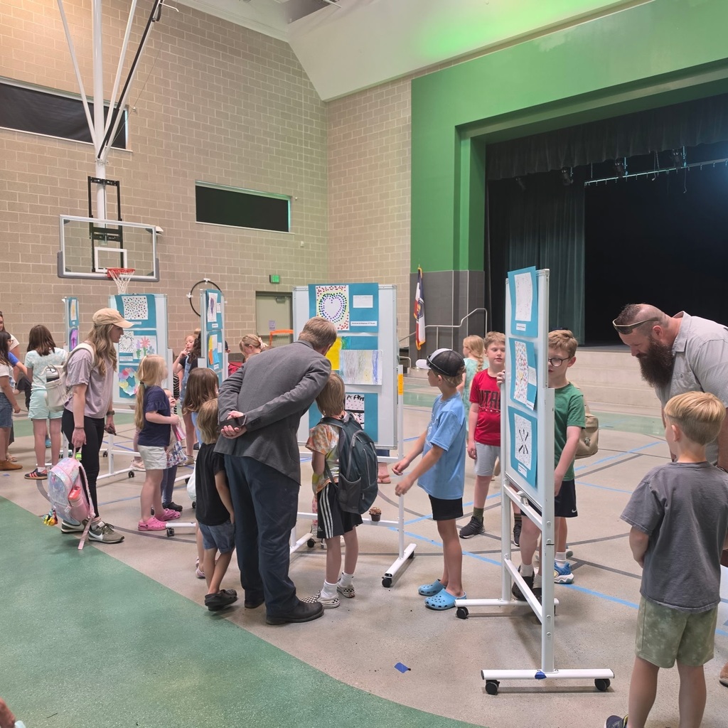 Families and students view Kind Kids Club artwork at Bountiful Elementary during the club’s final kindness art exhibit.