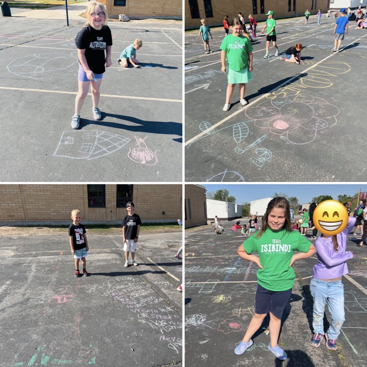 2nd graders drawing with chalk as part of a schoolwide activity 