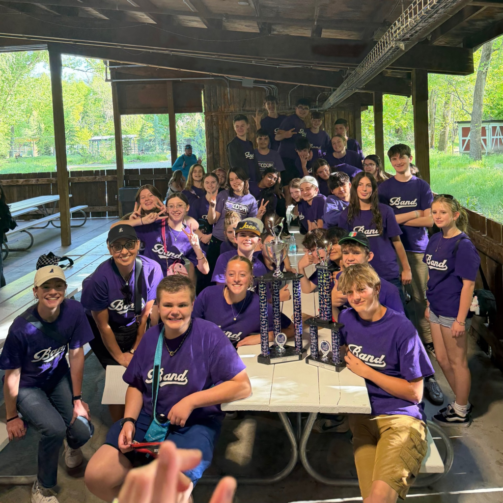 Concert Band Students at Lagoon with trophies
