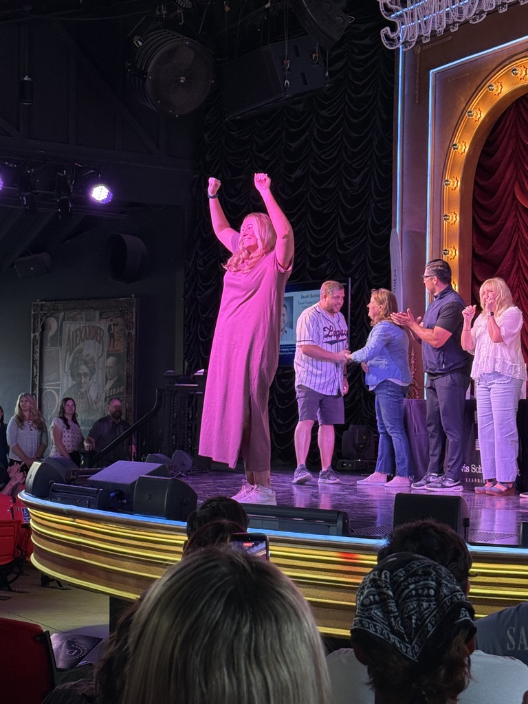 Mrs Barber on stage with other Teachers