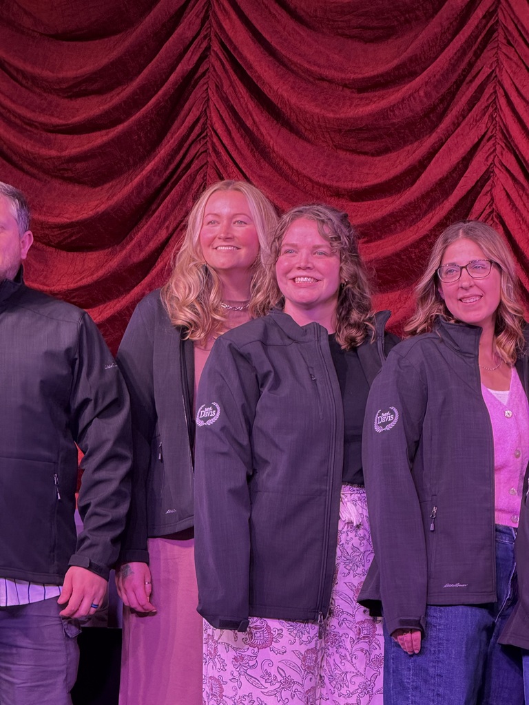 Mrs Barber on stage with other Teachers