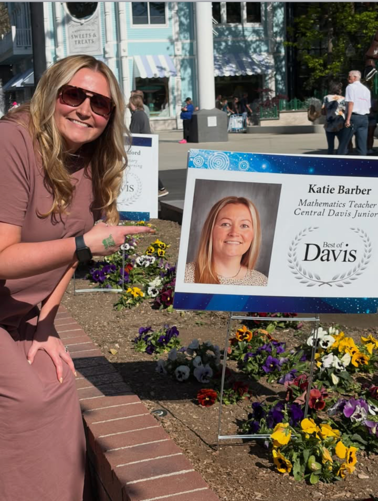 Mrs Barber Pointing to her Best of Davis Sign