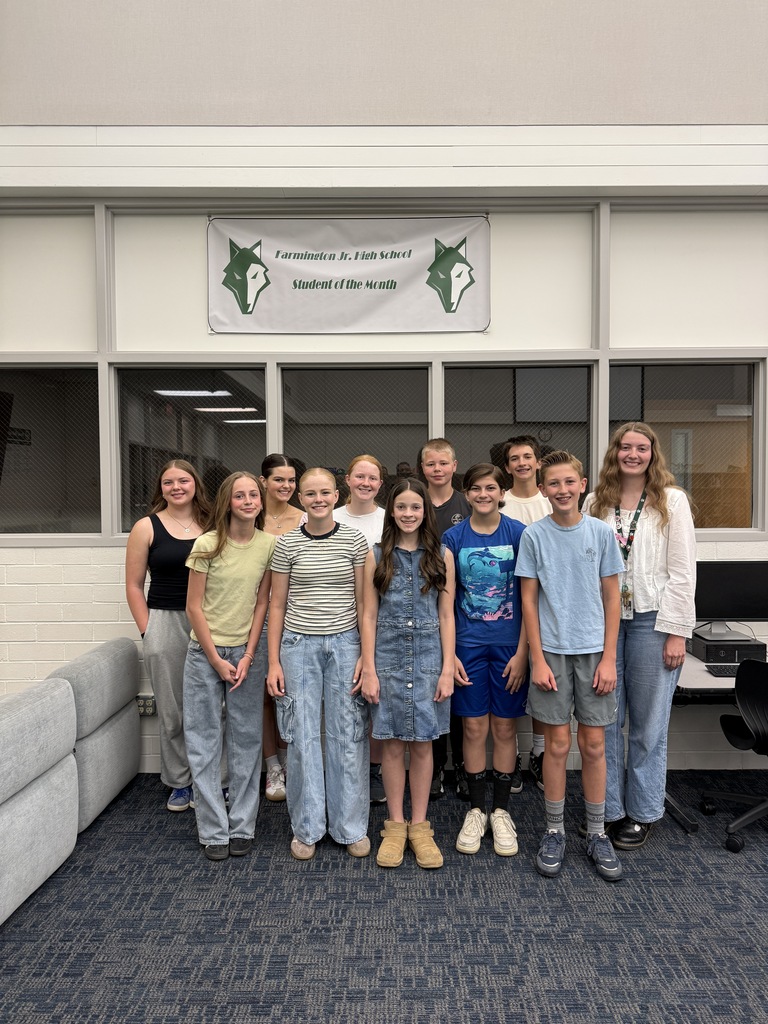 May students and educator of the month having their picture taken.  