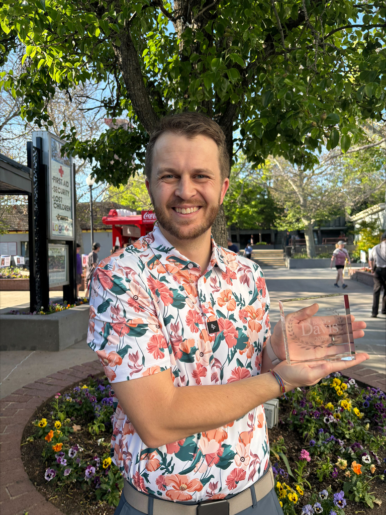 Mr. Rowley holding his Best of Davis Award