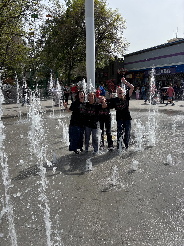 Students standing in the fountain at Lagoon.