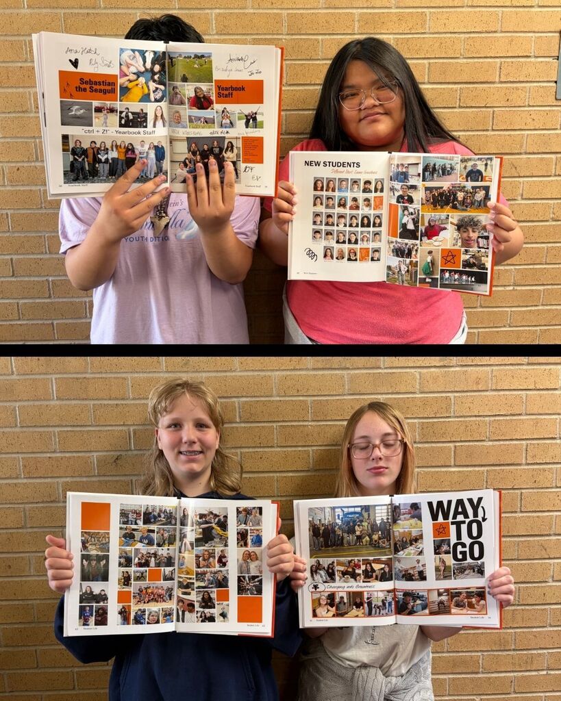 Groups of students hold different pages of the yearbook open