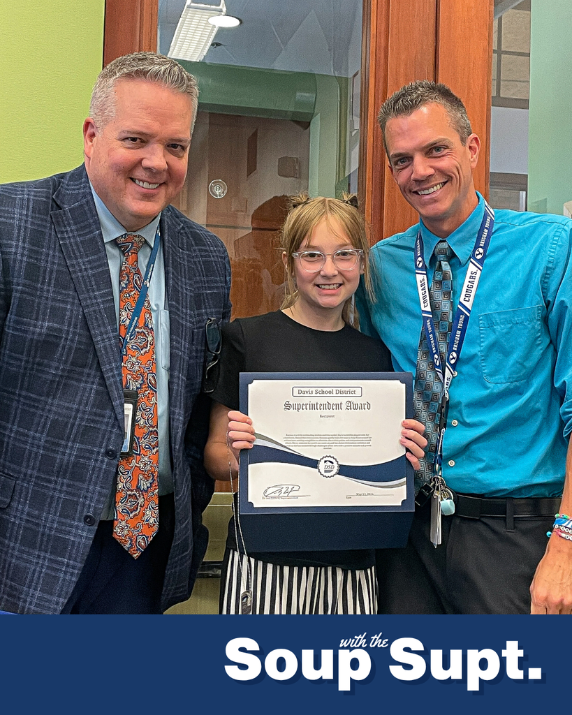 A student smiling with their principal and Dr. Linford, Davis School District Superintendent. 