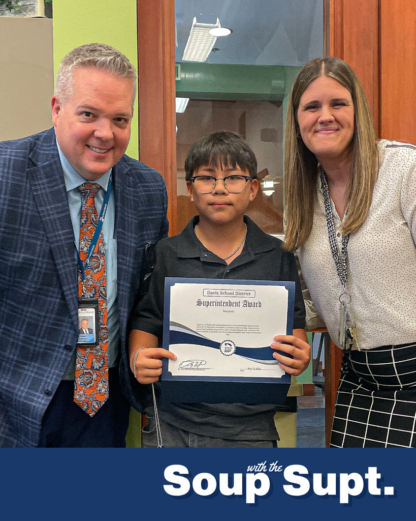 A student smiling with their principal and Dr. Linford, Davis School District Superintendent. 