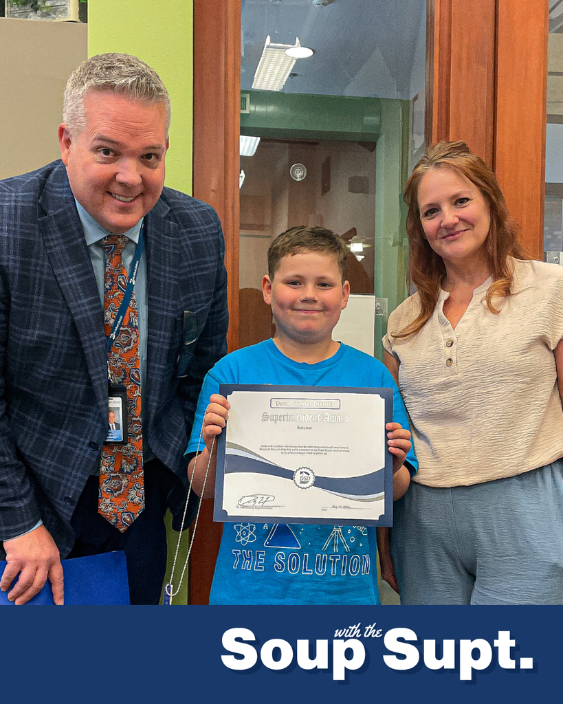 A student smiling with their principal and Dr. Linford, Davis School District Superintendent. 