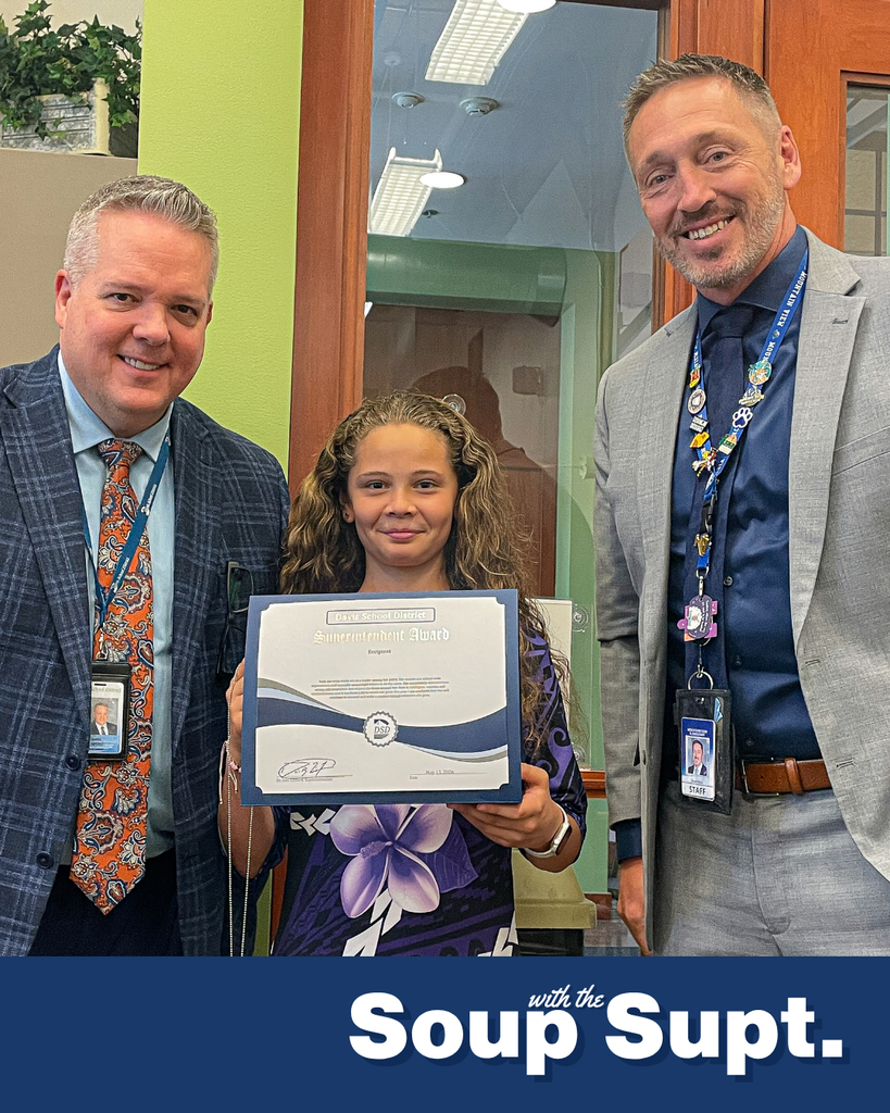 A student smiling with their principal and Dr. Linford, Davis School District Superintendent. 