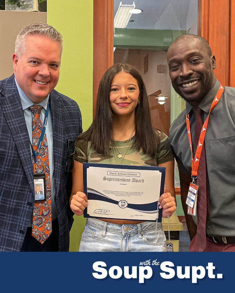 A student smiling with their principal and Dr. Linford, Davis School District Superintendent. 